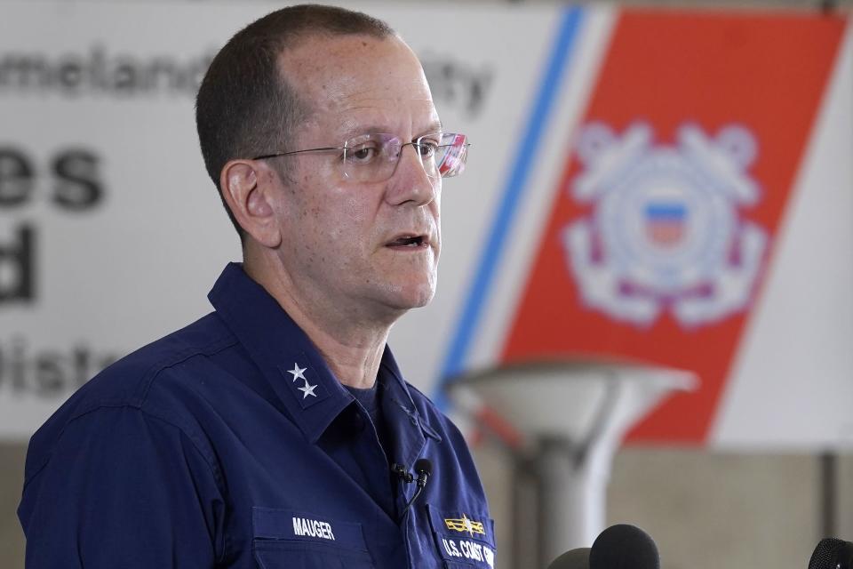 U.S. Coast Guard Rear Adm. John Mauger, commander of the First Coast Guard District, talks to the media, Monday, June 19, 2023, in Boston. A search is underway for a missing submersible that carries people to view the wreckage of the Titanic. Canadian officials say the five-person submersible was reported overdue Sunday night about 435 miles (700 kilometers) south of St. John's, Newfoundland and that the search is being led by the U.S. Coast Guard. (AP Photo/Steven Senne)