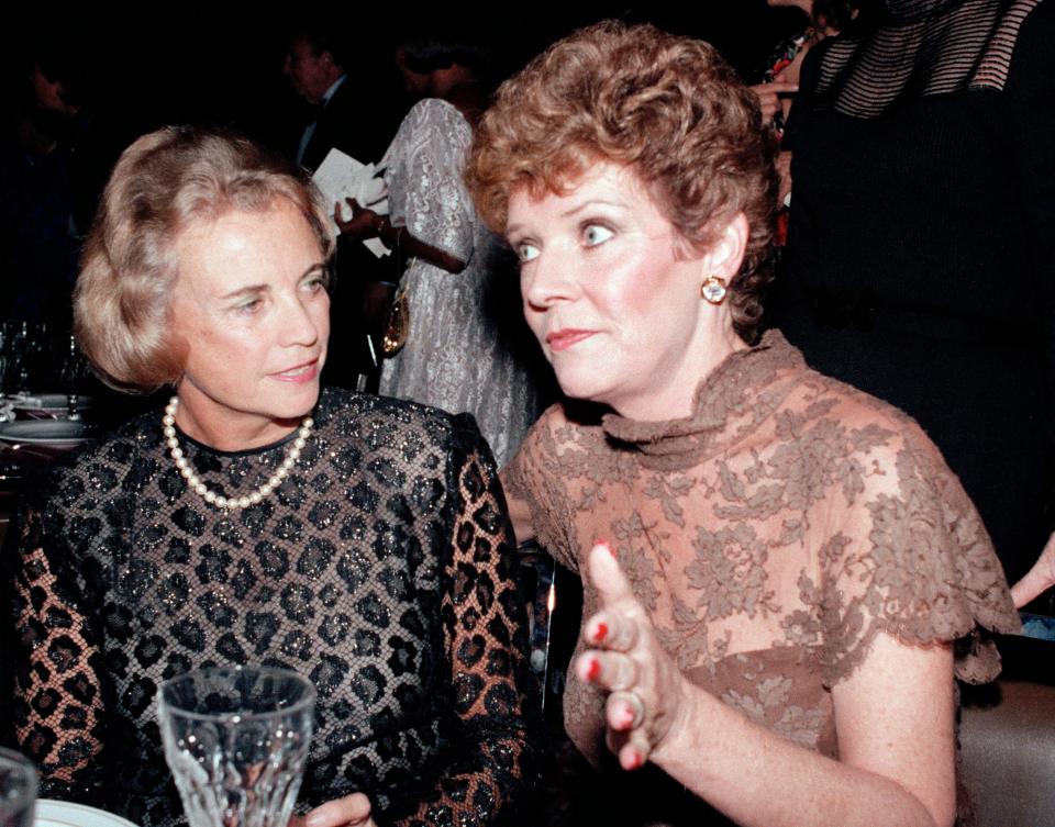 U.S. Supreme Court Justice Sandra Day O'Connor speaks with actress Polly Bergen at a National Women's Forum dinner in Washington, Oct. 3, 1985.  Justice O'Connor was inducted as the first member of the NWF's "Women's Hall of Fame."