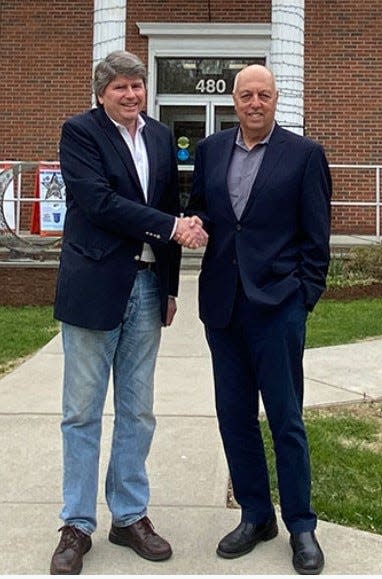 Incoming Franklin Lakes Mayor Charles Kahwaty is congratulated by outgoing Mayor Frank Bivona, who served 12 years.