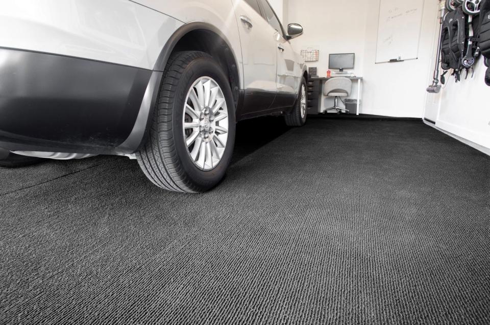 white car parked on top of Garage Grip flooring