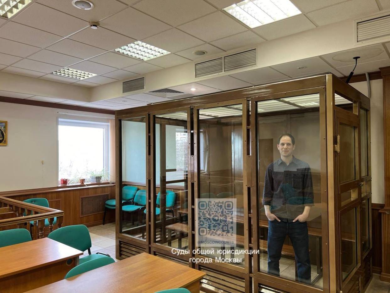 Journalist Evan Gershkovich standing inside a defendants' cage in Moscow, Russia, on March 26, 2024.