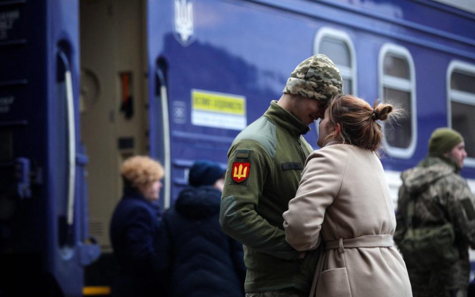 A Ukrainian soldier says goodbye to his girlfriend before leaving Lviv - Aleksey Filippov/AFP