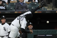 Chicago White Sox catcher Martin Maldonado misses the catch a foul ball hit by Atlanta Braves' Ronald Acuna Jr., during the first inning of a baseball game in Chicago, Tuesday, April 2, 2024. (AP Photo/Nam Y. Huh)