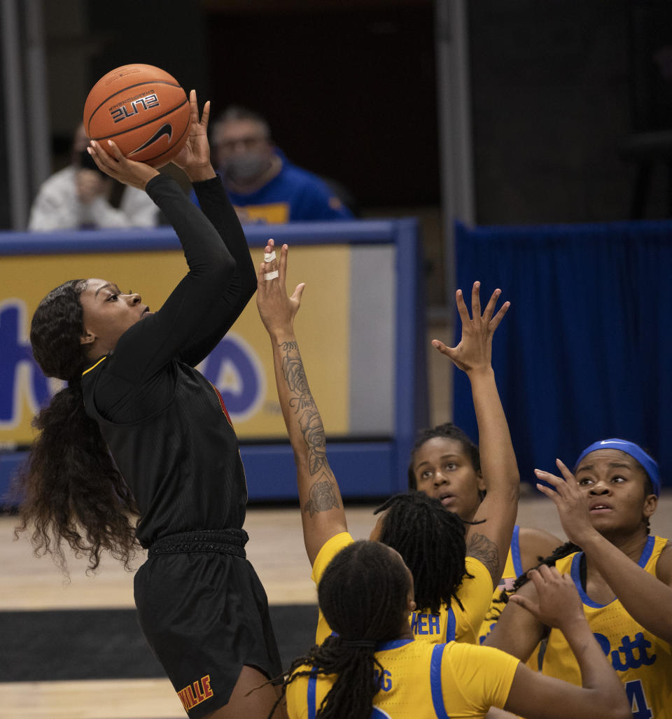 FILE - Louisville's Dana Evans (1) shoots as Pittsburgh defends in the first half of an NCAA college basketball game in Pittsburgh, in this Thursday, Feb. 18, 2021, file photo. Dana Evans once pondered transferring from Louisville before understanding that the opportunities would come. The senior guard has maximized them with ACC championships and her second conference player of the year selection this week. (AP Photo/Rebecca Droke, File)