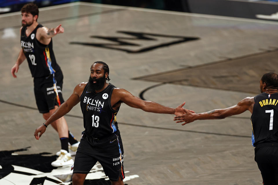 Brooklyn Nets guard James Harden (13) with Kevin Durant against the Boston Celtics in the second half of Game 5 during an NBA basketball first-round playoff series, Tuesday, June 1, 2021, in New York. (AP Photo/Adam Hunger)