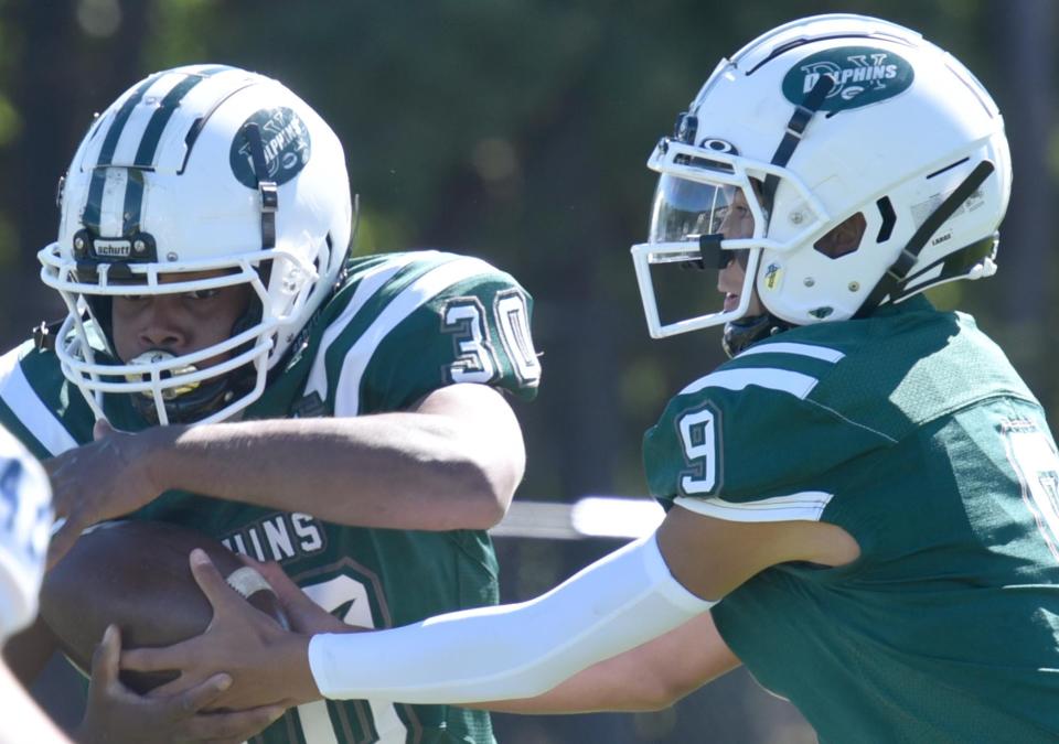 SOUTH YARMOUTH 9/24/22  D-Y's Alex Sheffield-White takes the hand off from quarterback Jayden Barber as Dennis-Yarmouth  High School played host to Stoneham High in  Saturday afternoon football action. 