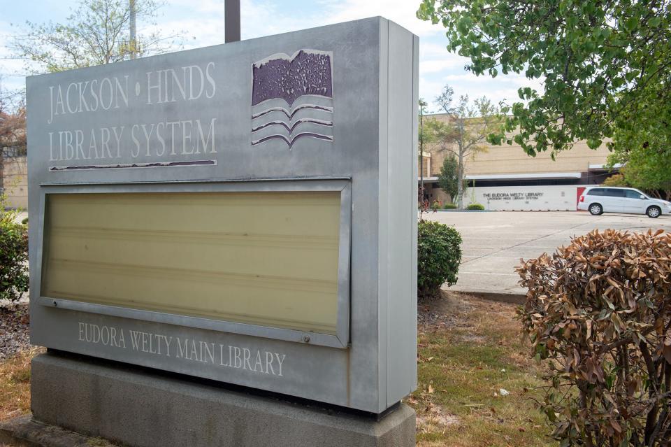 A faded Jackson-HInds Library System sign for its main library sits at the corner of State and Mississippi Street in Jackson, Miss., Sept. 12, 2023. According to the Eudora Welty Library webpage, last updated Sept. 14, 2021, the flagship library is closed closed until further notice.