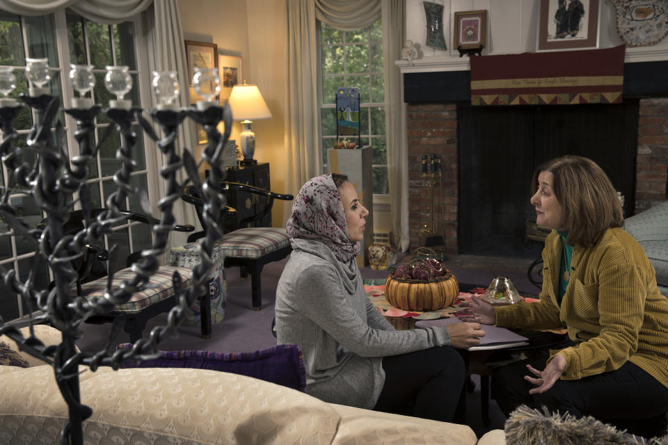 In this Thursday, Oct. 17, 2019, photo, Heba Macksoud, left, of Princeton, N.J., and Sheryl Olitzky, members of the Sisterhood of Salaam Shalom, sit together at Olitzky's home, in North Brunswick, N.J. As the one-year anniversary of Pittsburgh's Tree of Life synagogue attack approaches, and an anti-Semitic shooting in Germany on the holiest day of the Jewish calendar focuses attention anew on the rising tide of global hate crimes against the faith, Jewish and Muslim groups in the U.S. are forging durable alliances in pushing back against crimes targeting their respective communities. (AP Photo/Mel Evans)