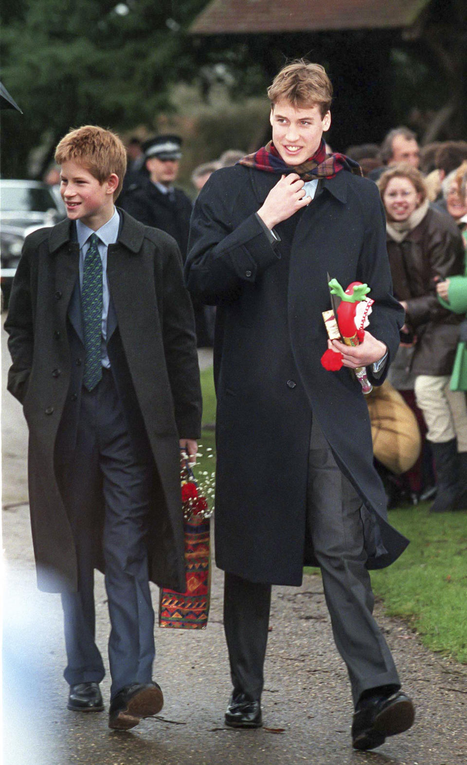 Prince Harry, and Prince William walk to the annual Christmas Day service at Sandringham Church, on December 25 1998 in Sandringham, England.