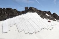 Parts of the Gurschengletscher glacier are covered with tarps in Andermatt