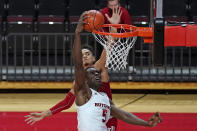 Rutgers center Cliff Omoruyi (5) misses a dunk with Indiana guard Khristian Lander defending during the second half of an NCAA college basketball game, Wednesday, Feb. 24, 2021, in Piscataway, N.J.(AP Photo/Kathy Willens)