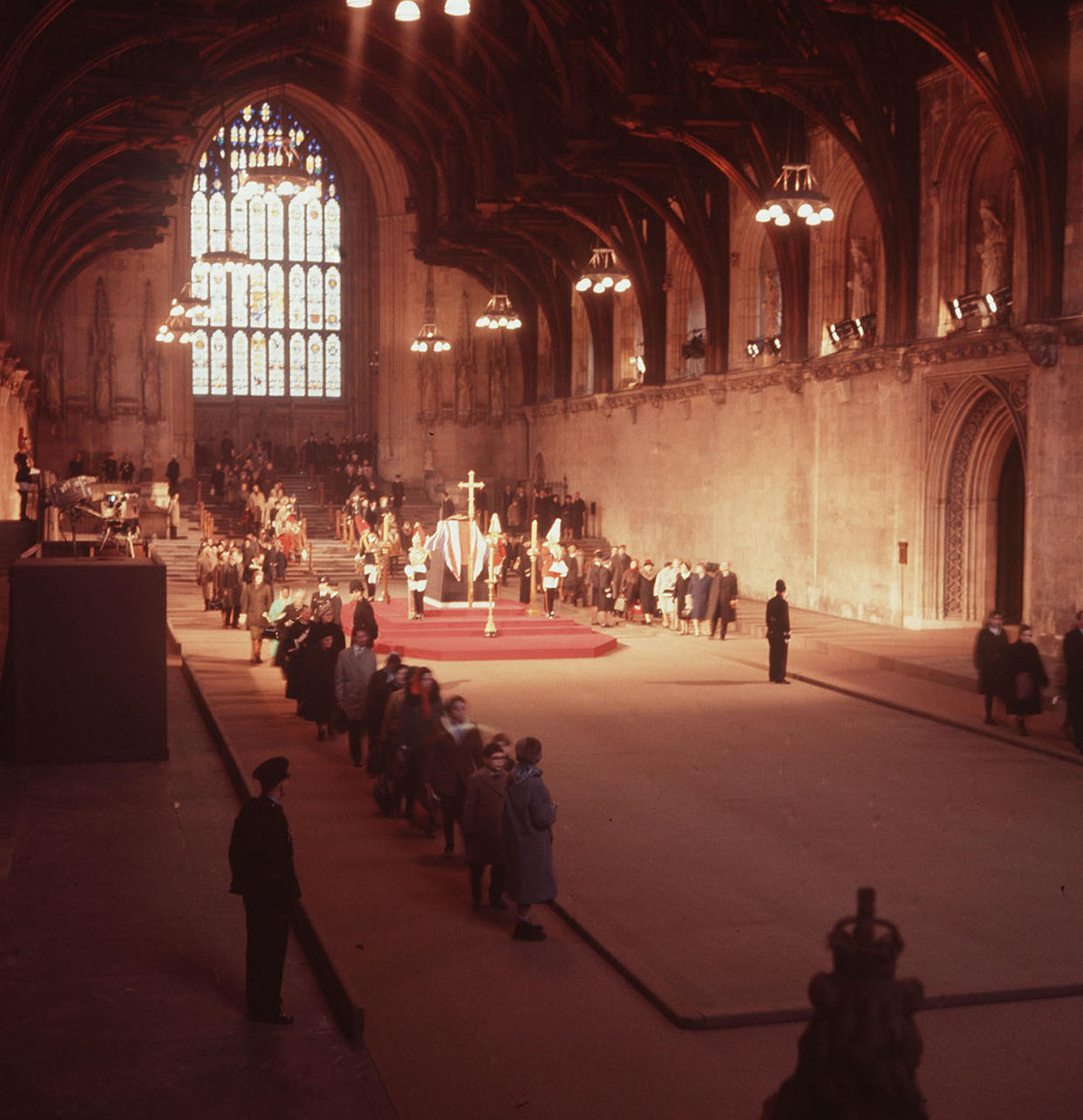 Members of the public filing through Westminster Hall, London, to pay their tributes at the lying-in-state of Sir Winston Churchill in 1965. (PA)