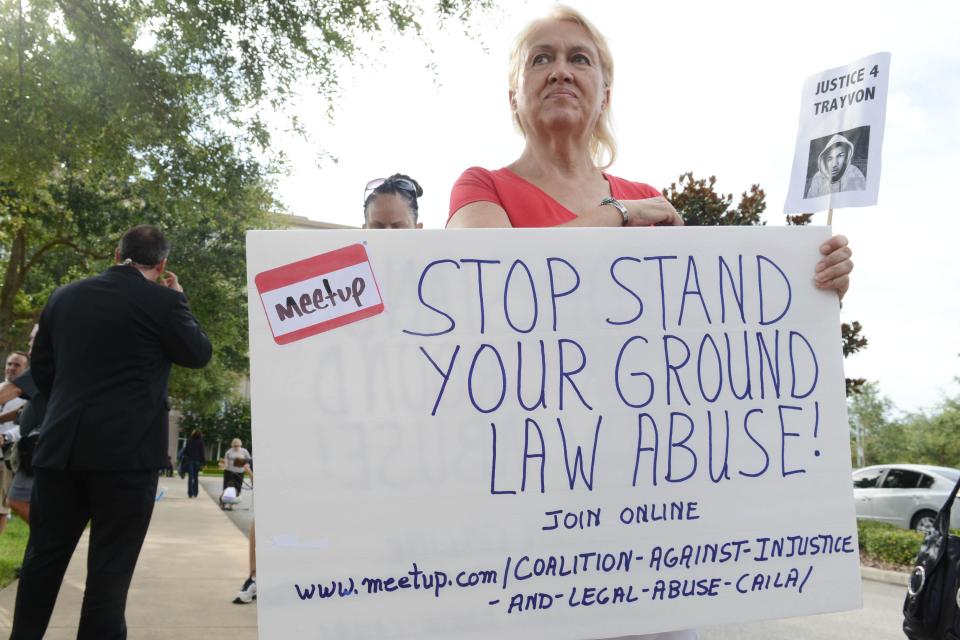 Cathy Makowski demonstrates against what she calls the abuse of Florida's "stand your ground" law in front of the Seminole County Courthouse in Sanford, Fla., after the shooting death of teenager Trayvon Martin in 2012.