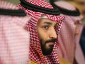 FILE - In this March 22, 2018, file photo, Saudi Crown Prince Mohammed bin Salman meets with U.S. Defense Secretary Jim Mattis at the Pentagon in Washington. In a kingdom once ruled by an-ever aging rotation of elderly monarchs, Saudi Crown Prince Mohammed bin Salman stands out as a youthful face of a youthful nation. But behind a carefully coiffed public-relations operation highlighting images of him smiling in meetings with the world’s top business executives and leaders like President Donald Trump, a darker side lurks as well.(AP Photo/Cliff Owen, File)