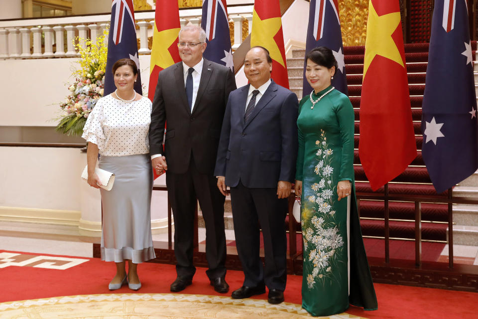 Australian Prime Minister Scott Morrison, second from left, and his wife Jenny Morrison, left, pose with Vietnamese Prime Minister Nguyen Xuan Phuc and his wife Tran Thi Nguyet Thu for a photo during a welcome ceremony at the Presidential Palace in Hanoi, Vietnam, Friday, Aug. 23, 2019. Morrison is on a three-day official visit to Vietnam. (AP Photo/Duc Thanh)