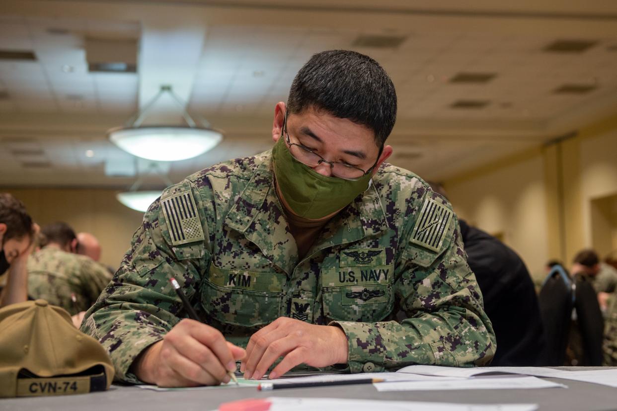 U.S. Navy Aviation Electronics Technician 1st Class John Kim, from Montgomery, takes the Chief Petty Officer exam at Vista Point on Norfolk Naval Base in Norfolk, Virginia, Jan. 20, 2022.