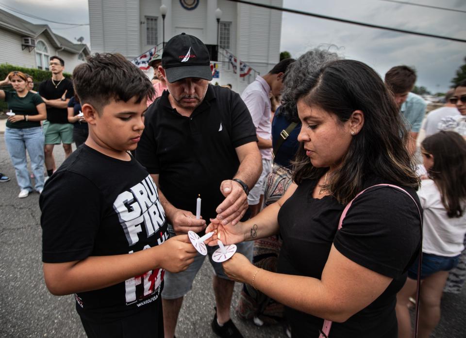 Mario and Martha Samano, along with their son David, 11, were among over one-hundred Mamaroneck residents who attended a candlelight vigil in front of village hall June 23, 2024 for six year-old Michael Volpe and his mother Molly Murphey Donovan. Michael and his mother died after being struck by a school bus mini-van near the Mamaroneck Avenue Elementary School June 20th.