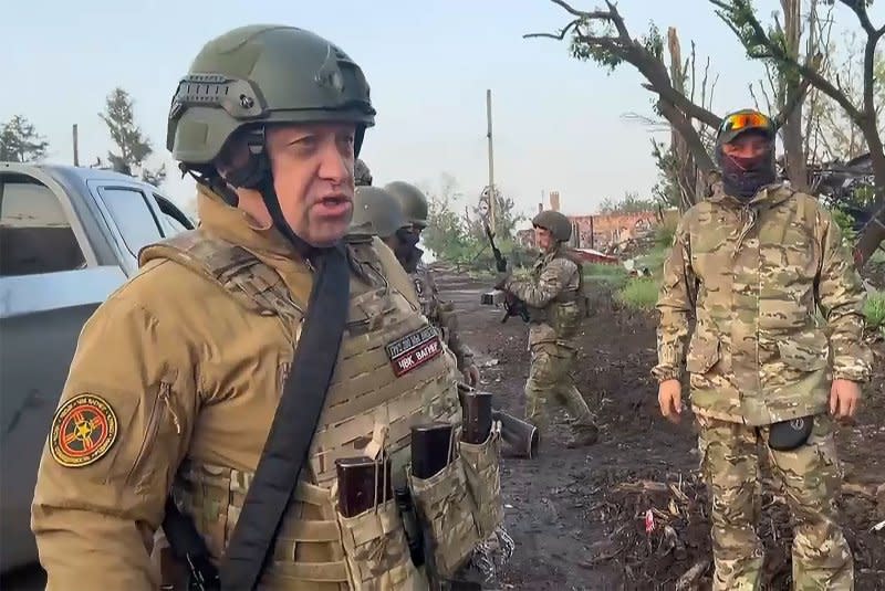 Wagner Group founder Yevgeny Prigozhin (L) addresses his units withdrawing from Bakhmut, Ukraine, on May 25. File Photo by Press service of Prigozhin/UPI