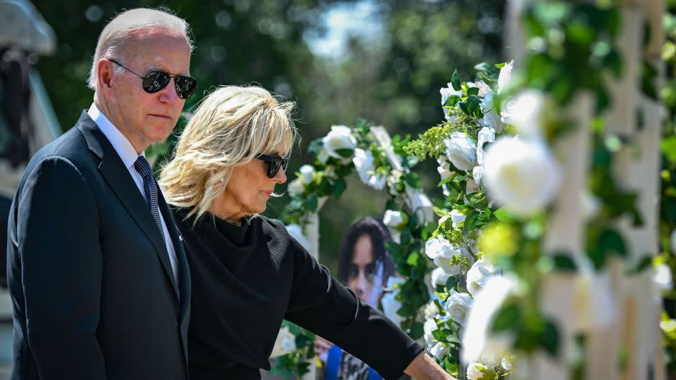President Joe Biden and first lady Jill Biden pay their respects at a makeshift memorial outside of Robb Elementary School in Uvalde, Texas, on May 29, 2022. - Mandel Ngan/AFP/Getty Images