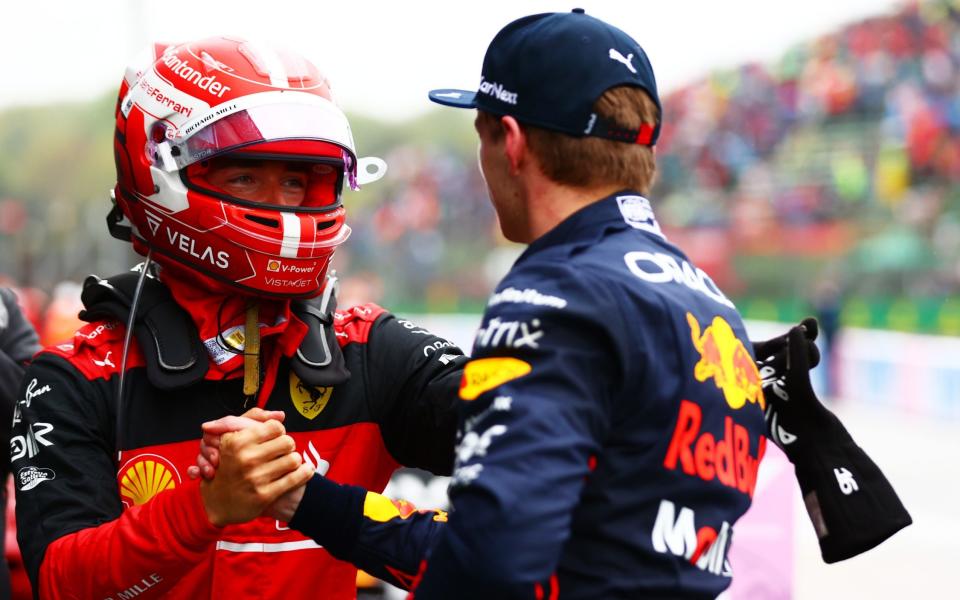 Pole position qualifier Max Verstappen of the Netherlands and Oracle Red Bull Racing and Second placed qualifier Charles Leclerc of Monaco and Ferrari shake hands in parc ferme during qualifying ahead of the F1 Grand Prix of Emilia Romagna at Autodromo Enzo e Dino Ferrari on April 22, 2022 in Imola, Italy - Dan Istitene - Formula 1/Formula 1 via Getty Images