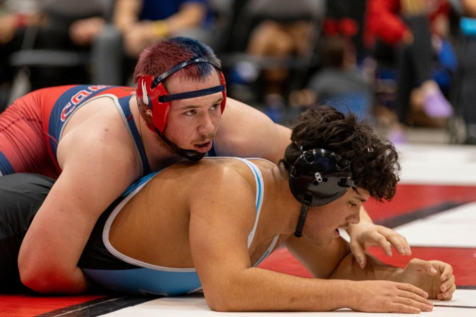 Seaman's Hunter Reno wrestles Goddard-Eisenhower's Lucas Freeman in the 5A Boys State Wrestling tournament at Hartman Arena on Saturday, Feb. 24, 2024.