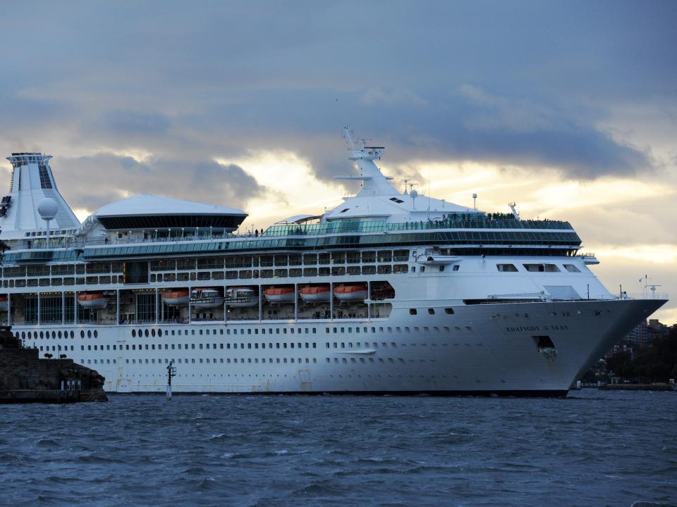 Cruise ship, Rhapsody of the Seas on October 29, 2010 in Sydney, Australia with cloudy skies behind it.