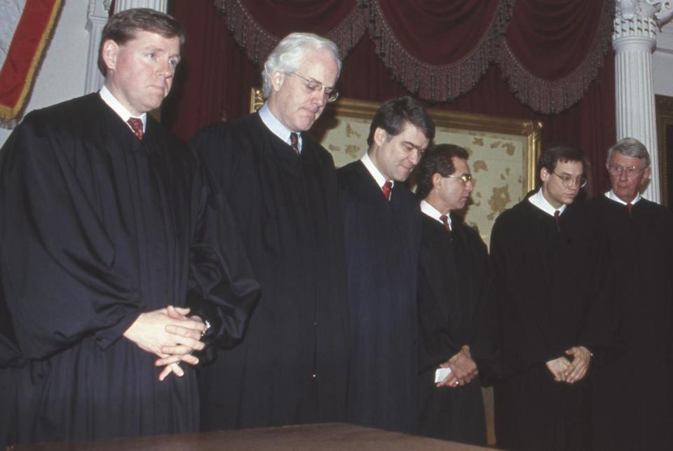 John Cornyn historical photos by Bob Daemmrich.    The year is in the file name.   

This was taken in the House chamber in 1993. 

Left to right,  Justice CRAIG ENOCH, Justice JOHN CORNYN, Justice NATHAN HECHT, Justice RAUL GONZALEZ, Justice TOM PHILLIPS, Justice JACK HIGHTOWER