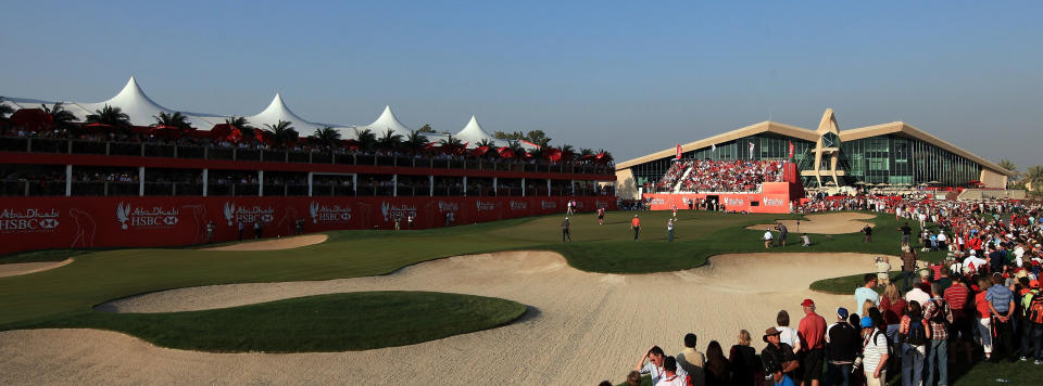 ABU DHABI, UNITED ARAB EMIRATES - JANUARY 28: The Tiger Woods, Rory McIlroy and Robert Karlsson group on the green at the par 5, 18th hole during the third round of the Abu Dhabi HSBC Championship at the Abu Dhabi Golf Club on January 28, 2012 in Abu Dhabi, United Arab Emirates. (Photo by David Cannon/Getty Images)