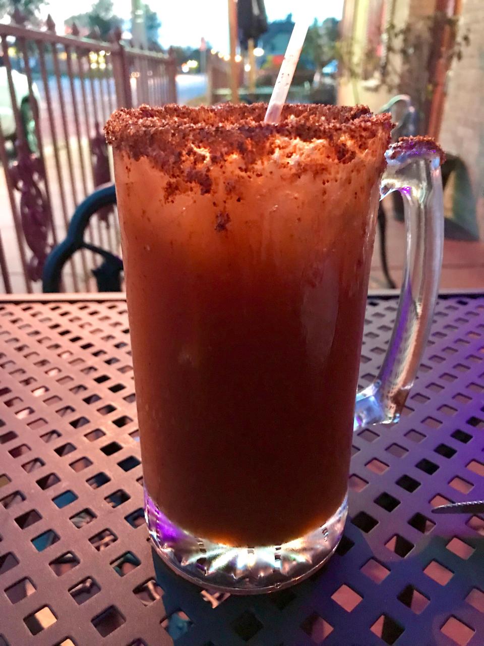 A Tajin-crusted rim of the michelada at Tu Casa Mexican Restaurant, 3710 W. Lincoln Ave., flavors sips of the drink.