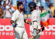 Cricket - India v England - First Test cricket match - Saurashtra Cricket Association Stadium, Rajkot, India - 11/11/2016. India's Murali Vijay (L) is congratulated by his teammate Cheteshwar Pujara after scoring his century. REUTERS/Amit Dave