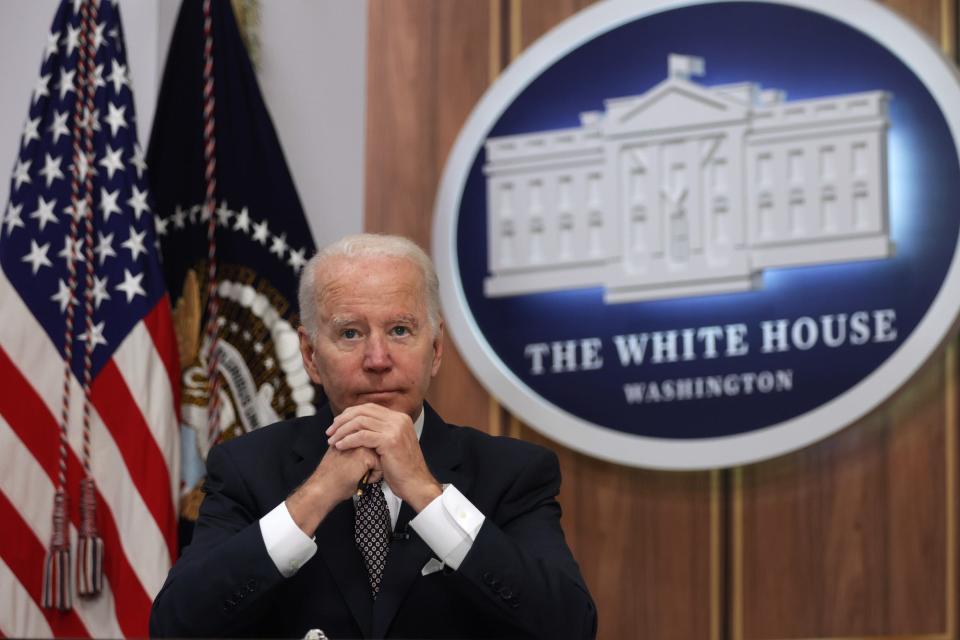 US President Joe Biden, sitting with his hands clasped in front of him, awaits the beginning of a virtual Major Economies Forum on Energy and Climate at the South Court Auditorium at Eisenhower Executive Office Building June 17, 2022 in Washington, DC.