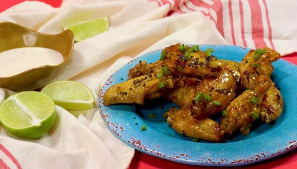 <p>Parade</p><p>Make these sweet and spicy wings in your air fryer for extra hosting ease.</p><p><strong>Get the recipe: <a href="https://parade.com/690117/parade/make-honey-sriracha-wings-in-your-air-fryer/" rel="nofollow noopener" target="_blank" data-ylk="slk:Honey-Sriracha Wings;elm:context_link;itc:0;sec:content-canvas" class="link ">Honey-Sriracha Wings</a></strong></p>