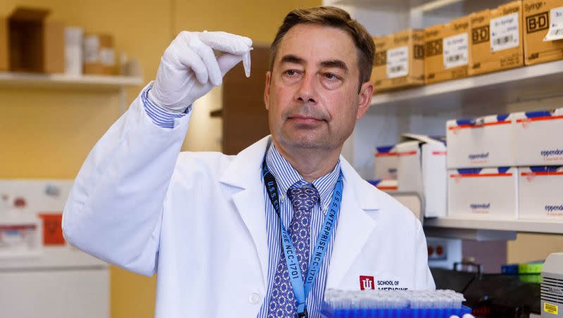 Dr. Alexander Niculescu works in a lab at Indiana University in Indianapolis, Ind.