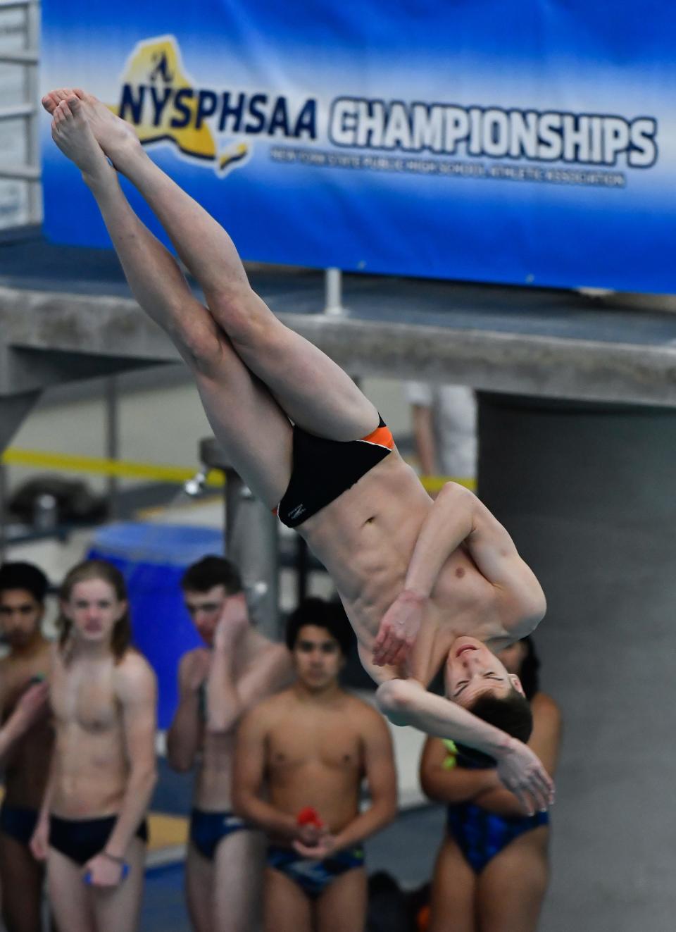 Pittsford's Daley Fraser executes a dive during the 2022 NYSPHSAA Boys Swimming & Diving Championships in Ithaca, N.Y., Friday, March 4, 2022.