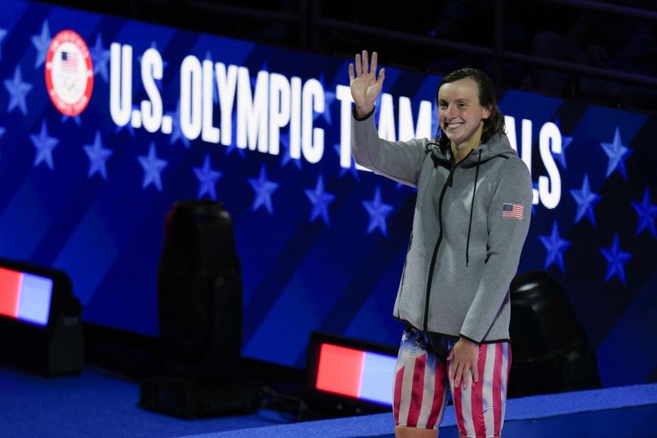 Katie Ledecky waves at the medal ceremony after winning the women's 1500 freestyle during wave 2 of the U.S. Olympic Swim Trials on Wednesday, June 16, 2021, in Omaha, Neb. (AP Photo/Jeff Roberson)