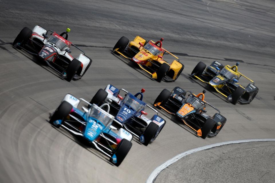 FORT WORTH, TEXAS - APRIL 02: Pato O'Ward, driver of the #5 Arrow McLaren Chevrolet,  Roman Grosjean, driver of the #28 DHL Honda, Colton Herta, driver of the #26 Gainbridge Honda, 
 and David Malukas, driver of the #18 HMD Trucking Honda, race during the NTT IndyCar Series PPG 375 at Texas Motor Speedway on April 02, 2023 in Fort Worth, Texas.