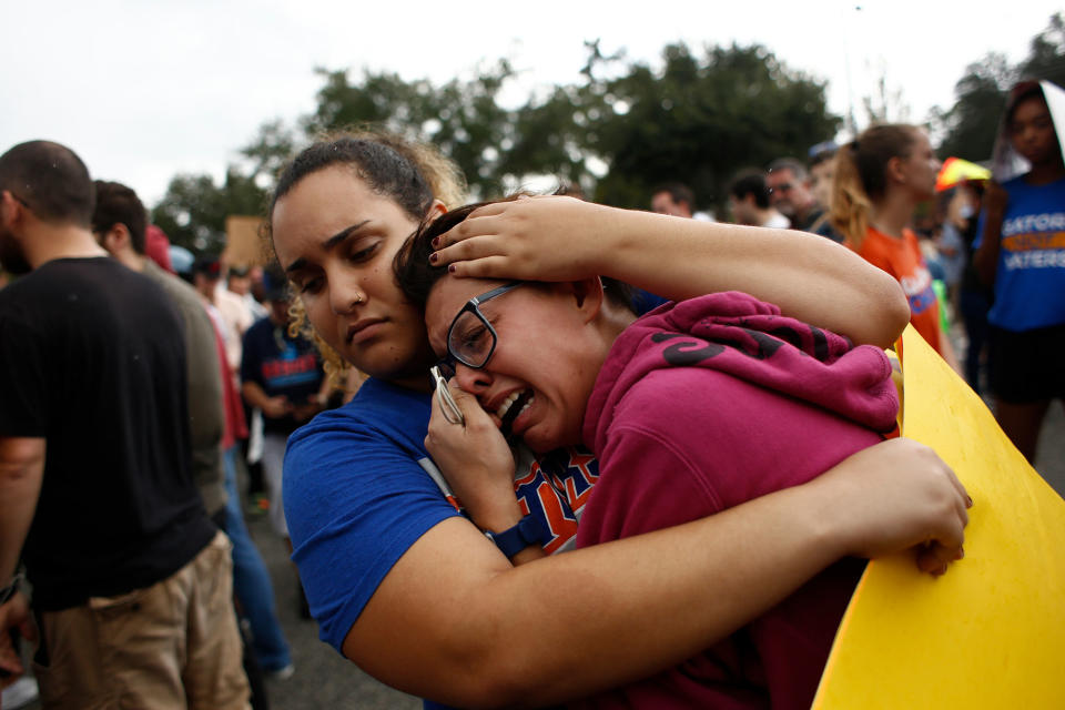 <p>A woman cries and is comforted by a demonstrator after she was refused entry into a planned speech by Richard Spencer, a white nationalist who popularized the term ‘alt-right’, at the University of Florida campus on Oct.19, 2017 in Gainesville, Fla. (Photo: Brian Blanco/Getty Images) </p>