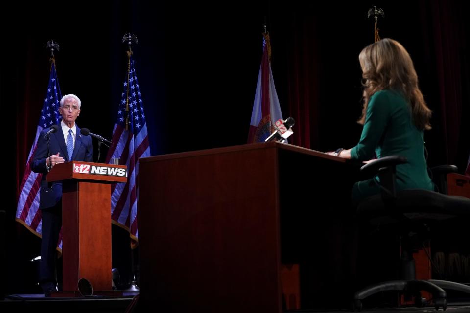 Florida's Republican incumbent Gov. Ron DeSantis and Charlie Crist, a former governor, take the stage at Sunrise Theatre for their only scheduled debate, Monday, Oct. 24, 2022, in Fort Pierce.