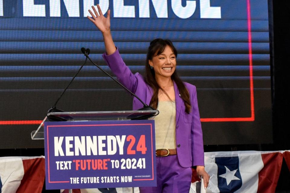Nicole Shanahan waves as she becomes the vice presidential candidate of independent presidential candidate Robert F Kennedy, Jr, in Oakland, California (REUTERS)