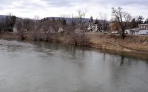 The west branch of the Susquehanna River flows past Jersey Shore, Pa. on Sunday March 23, 2014. About a third of the borough (population 4,300) is in a flood hazard zone and nearly 470 homes in town are expected to see flood insurance premium hikes because of changes to the National Flood Insurance Program. (AP Photo/Ralph Wilson)