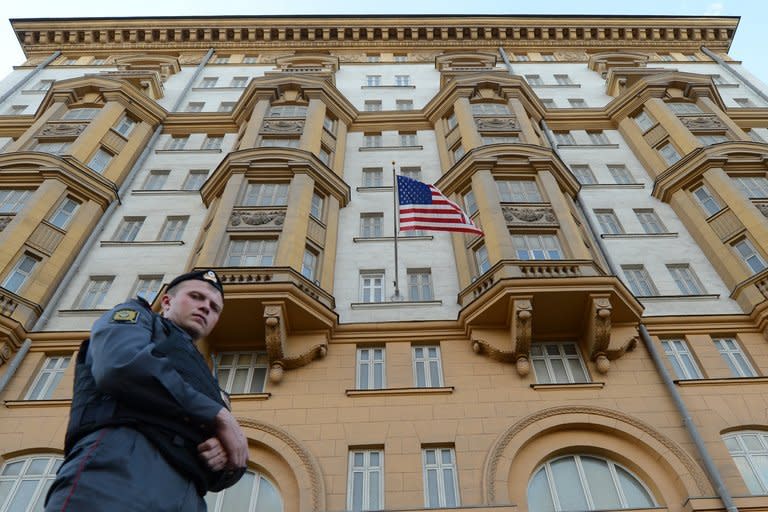 A Russian police officer patrols a street in front of the US Embassy in Moscow on September 20, 2012. Fugitive US intelligence leaker Edward Snowden accused US President Barack Obama of "pressuring the leaders" of countries from which he has sought protection