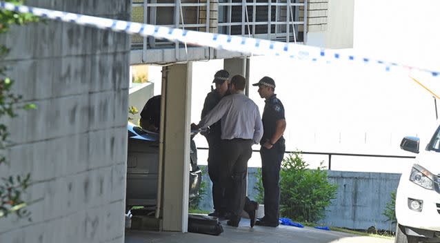 Police attend the scene of the apartment building in Auchenflower. Photo: AAP