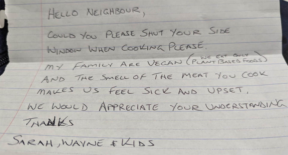 A handwritten note from a vegan asking their neighbours to shut their windows while cooking meat.