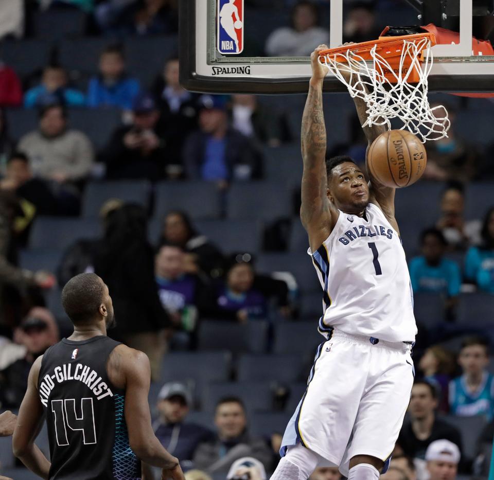 Memphis Grizzlies' Jarell Martin (1) dunks as Charlotte Hornets' Michael Kidd-Gilchrist (14) watches during the first half of an NBA basketball game in Charlotte, N.C., Thursday, March 22, 2018. (AP Photo/Chuck Burton)