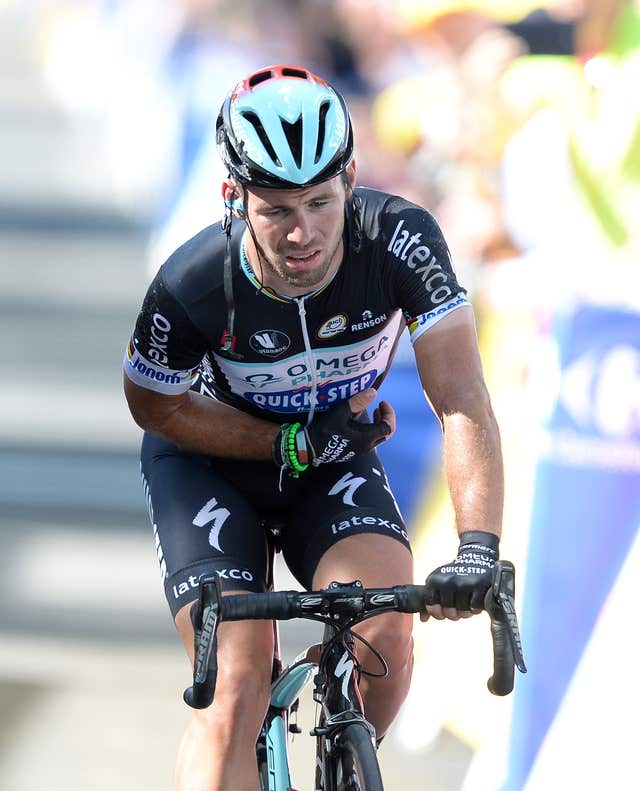 Mark Cavendish limps over the line with an injured shoulder