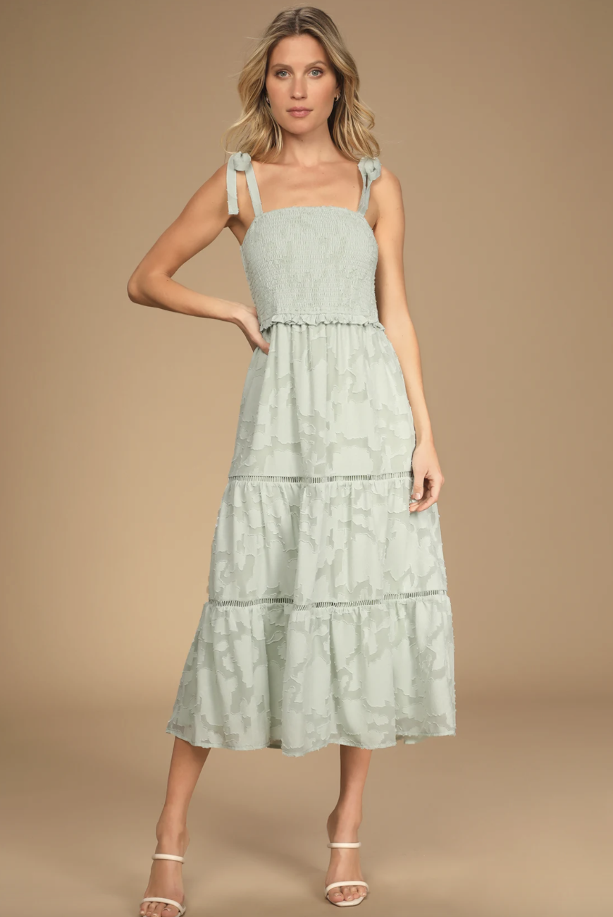 blonde model in light sage green Float to Love Tie-Strap Midi Dress (Photo via Lulus)