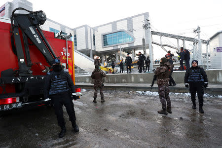 Turkish police stand guard near the scene of a high speed train crash in Ankara, Turkey December 13, 2018. REUTERS/Tumay Berkin