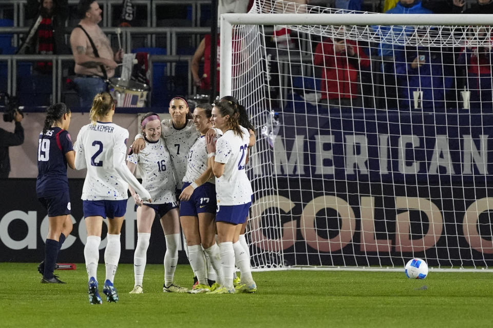 United States' Alex Morgan (7) celebrates with teammates after scoring on a penalty kick against the Dominican Republic during the second half of a CONCACAF Gold Cup soccer match in Carson, Calif., Tuesday, Feb. 20, 2024. The U.S. won 5-0. (AP Photo/Damian Dovarganes)