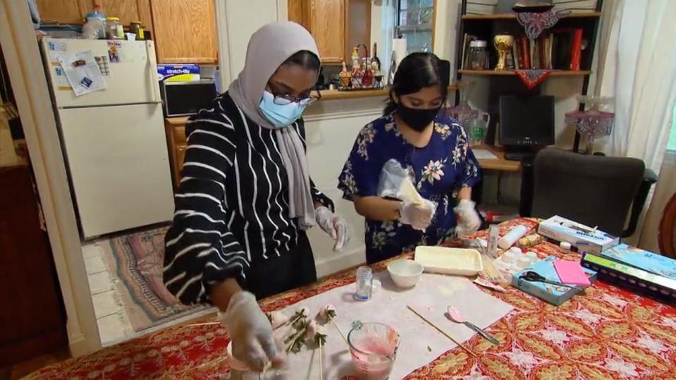 Virginia high school seniors Farah Bahr and Sithiya Reshmee learned how to make candy to sell during the pandemic.  / Credit: CBS News