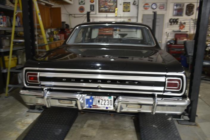The 1965 Chevelle parked in the Sims' garage